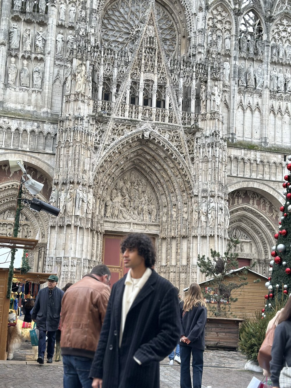 Joe K. Vernon before the Gothic west front of Rouen Cathedral.